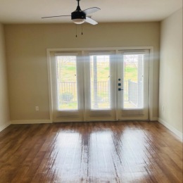 unfurnished living room with hardwood floors