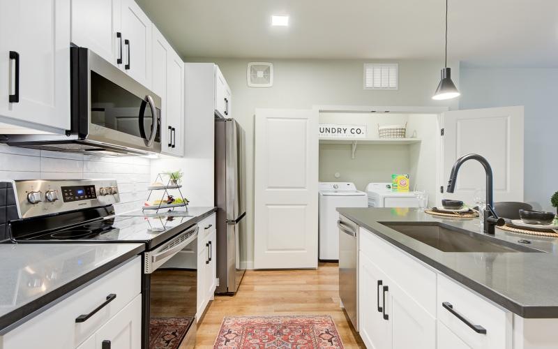 a kitchen with white cabinets