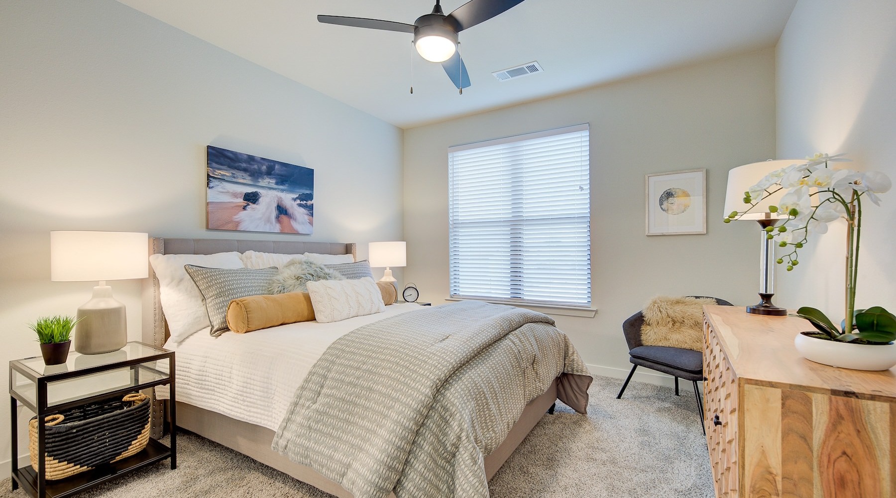 a bedroom with a bed and a fan
