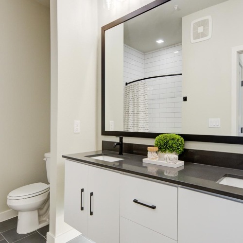 a bathroom with a large mirror